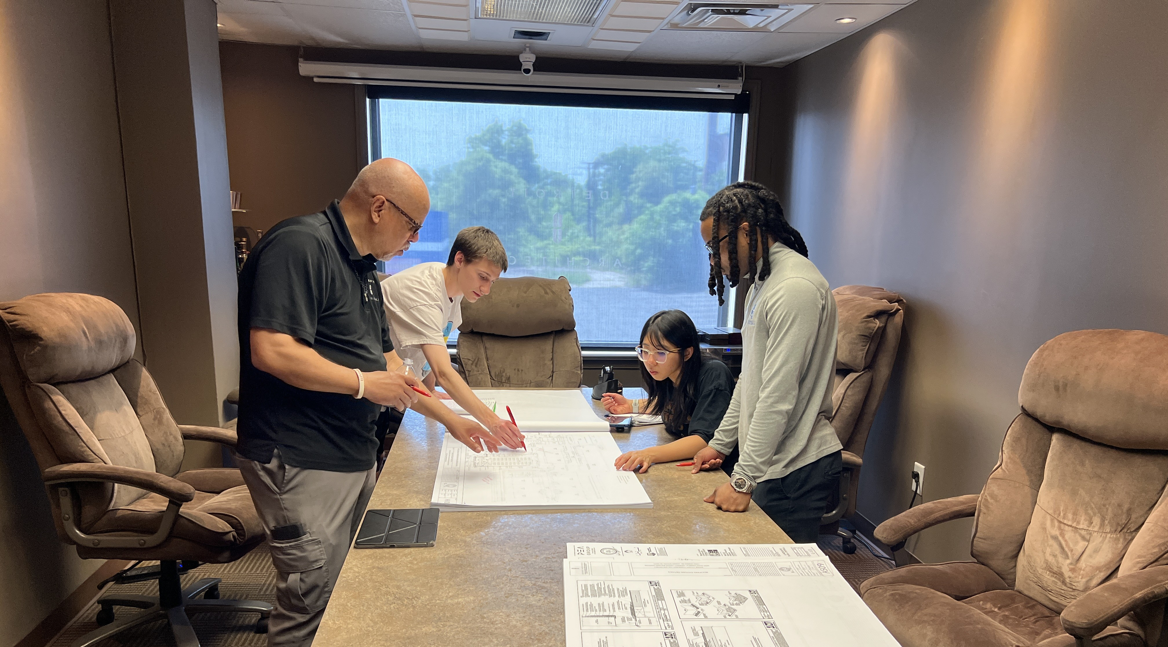 Detroit Architect team reviewing drawings